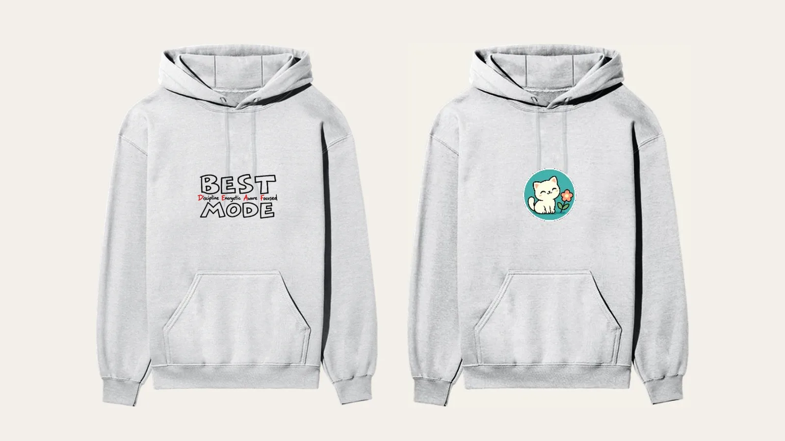 Two grey pullover hoodies, one with BEST MODE across the chest and one with a small round cat badge