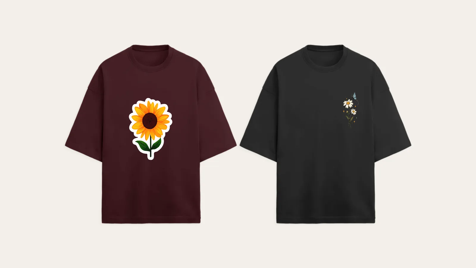 A maroon oversized tee with a big sunflower print next to a black tee with a small daisy on the chest
